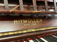 Load image into Gallery viewer, Ritmüller Upright Piano in Ornate Rosewood Cabinetry With Decorative Inlay