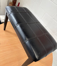 Load image into Gallery viewer, Black polished piano stool with seamed upholstered leatherette top and storage