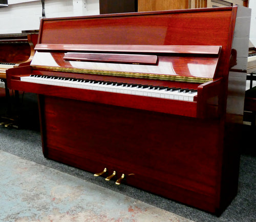 Schumann Upright Piano in polished Mahogany Cabinet