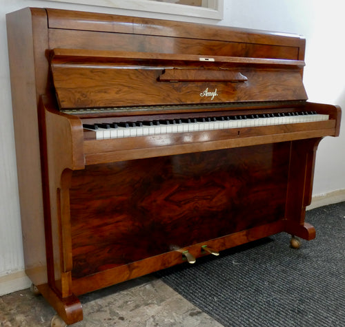 Amyl Upright Piano in book matched walnut finish