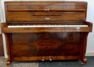 Amyl Upright Piano in book matched walnut finish