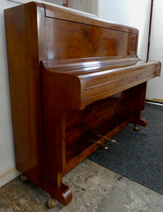 Amyl Upright Piano in book matched walnut finish