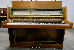 Rippen studio piano in mid century design