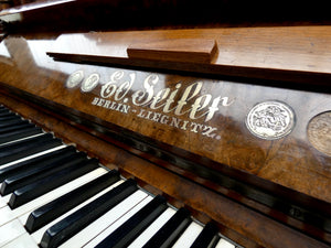 Ed. Seiler Antique Upright Piano in Ornate Burr Walnut Cabinetry